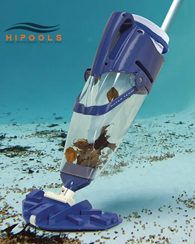 An automatic pool vacuum cleaning the bottom of an inground swimming poo