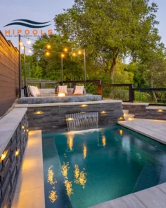 Designer infinity pool with fire features and LED lighting.